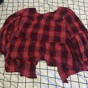 This is a red flannel and it buttons in the back instead of the front. So cute.